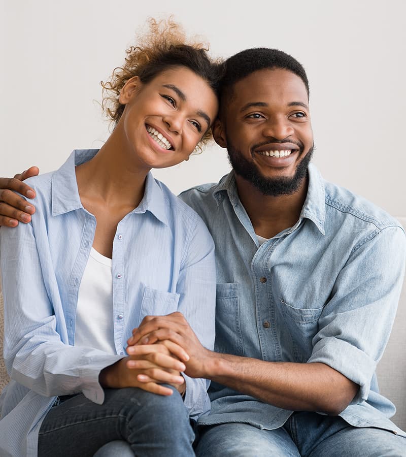 Couple embracing after a healing therapy session
